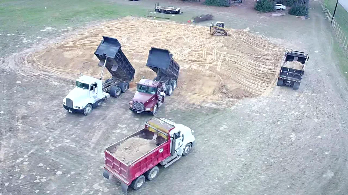 Fill dirt being delivered to prepare a building pad on a Liberty Seal Builder job site