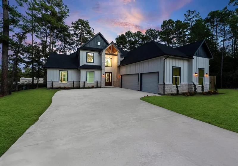 40714 Rolling Forest Dr, Magnolia TX — exterior front twilight