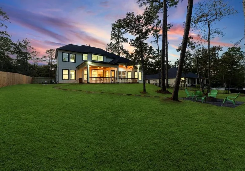 40714 Rolling Forest Dr, Magnolia TX — exterior rear twilight